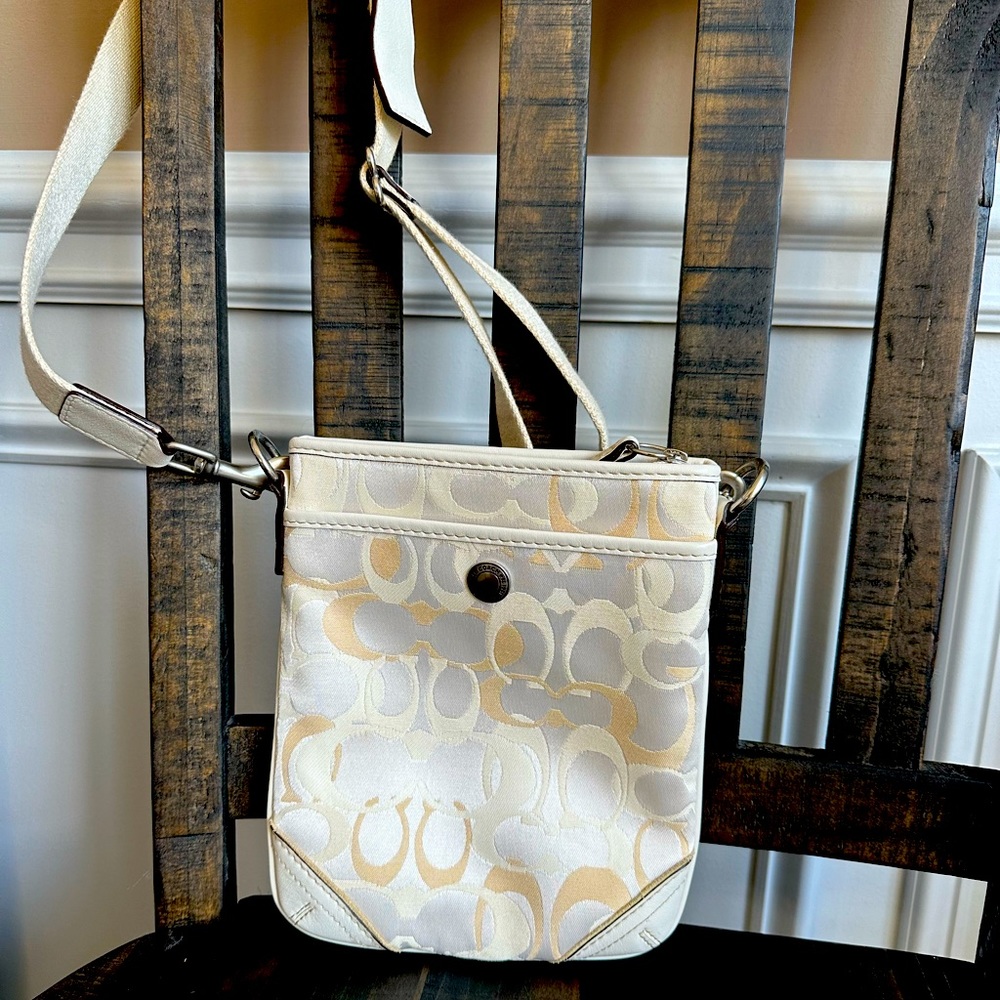 Coach cream crossbody.  8.5” tall & 7” wide with a front pocket.